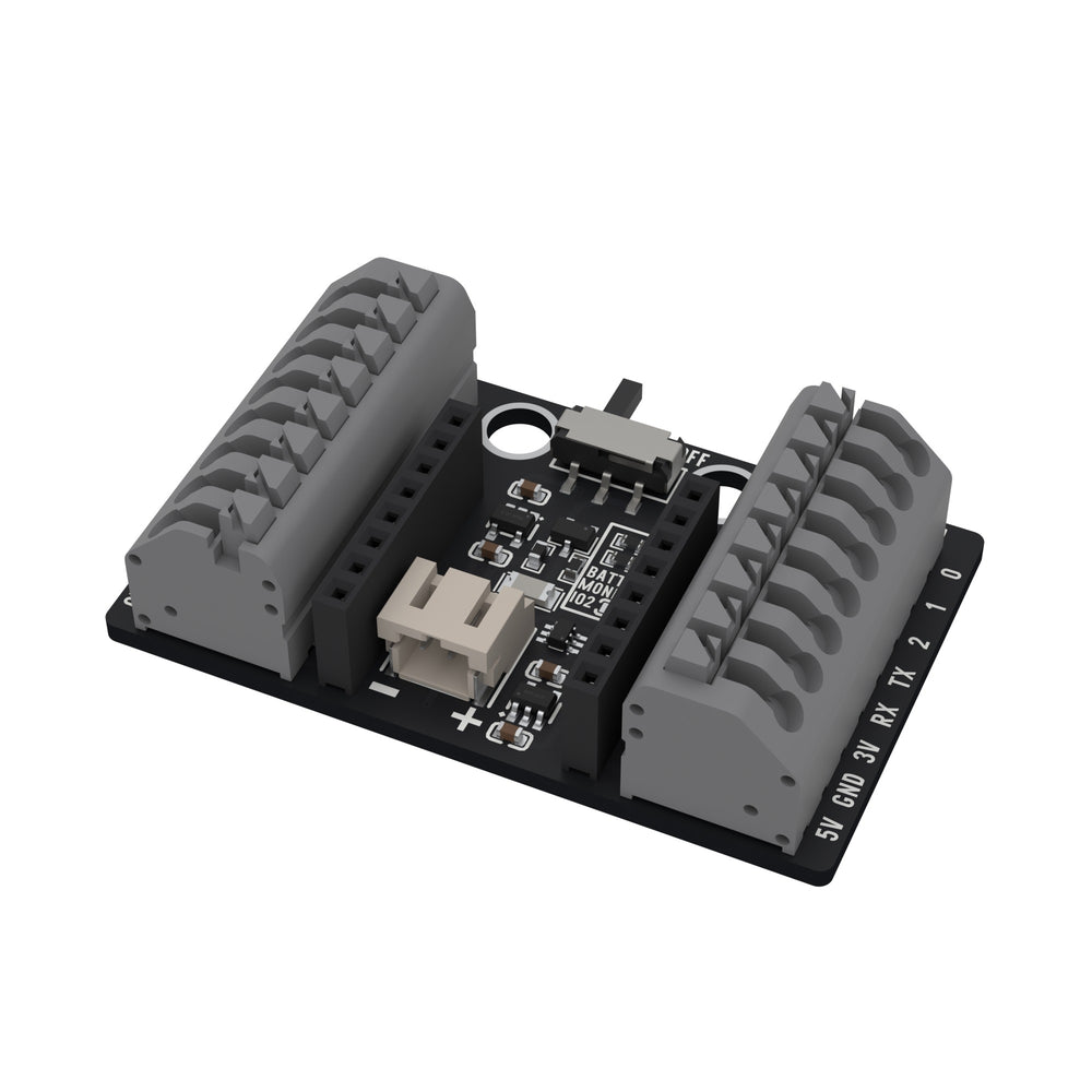 The ESP32-C3 OLED pluggable terminal base from an oblique angle, showing the two push-in terminal blocks and the battery connector.